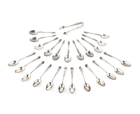 A set of twelve late Victorian silver apostle top teaspoons, London 1883, and another set of twelve silver teaspoons with mat