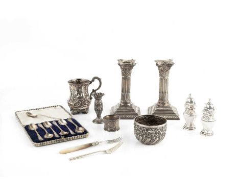 A pair of Edwardian silver candlesticks, of corinthian column form, on weighted gadrooned and stepped square bases, Sheffield