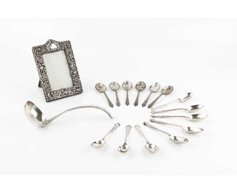 A Dutch silver sauce ladle, with beaded decoration, 16.5cm long, a set of eight silver coffee spoons, London 1932, a set of s