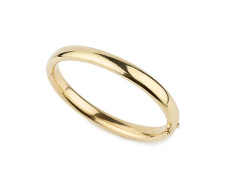 A French yellow gold oval hinged bangle, of plain design, 6.8cm wideApprox 25gBangle appears to be in good condition with a f