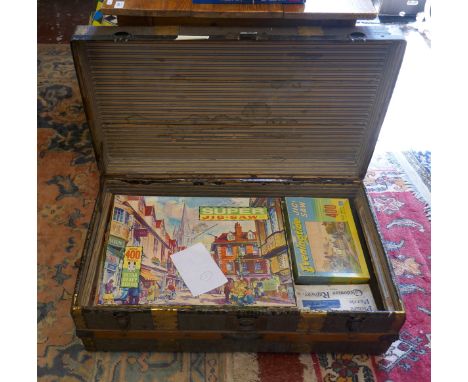 Vintage travel trunk full of vintage jigsaws 