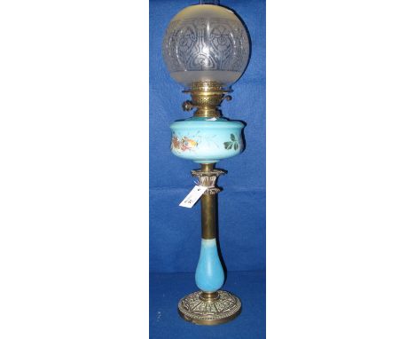 Late 19th Century brass double burner oil lamp with foliate painted ceramic reservoir on brass and ceramic pedestal with repo