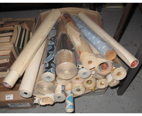Box of vintage and other wall paper rolls.