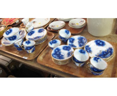 Two trays of gilt blue and white foliate teaware to include: cups; saucers; plates; milk jug and sucrier. (2) CONDITION REPOR