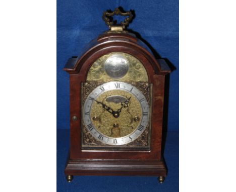 A modern Wuba three train arch top bracket clock with silvered and brass face. 