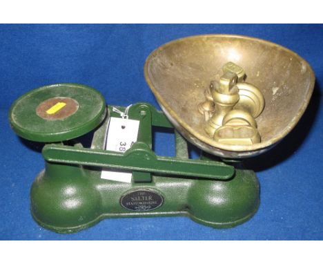 Set of Salter kitchen scales together with a set of six brass bell shaped weights.