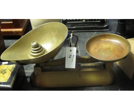 Set of W&T Avery and Company Ltd. scales with copper pans and various brass weights.