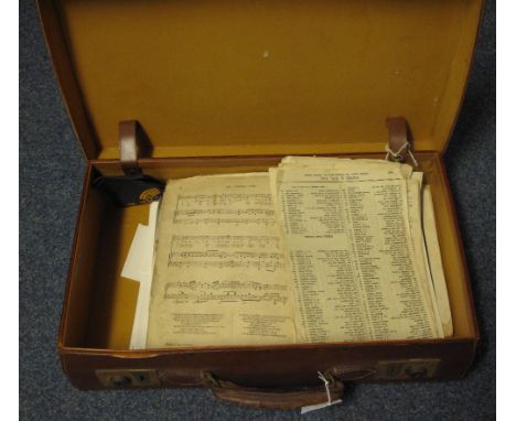 Small vintage leather suitcase containing an assortment of Welsh interest sheet music.