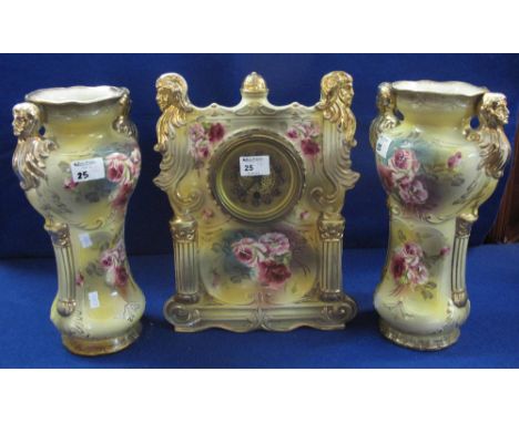 Staffordshire pottery architectural clock garniture, the clock with column and figural mounts around a gilded face, the suppo