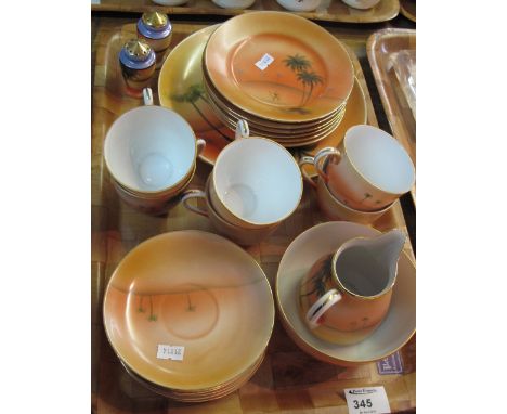 Tray of Japanese Noritake teaware items on an orange ground with camels and palm trees comprising: tea cups; saucers; milk ju