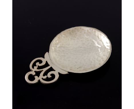 John Stuart Shellis, an Arts and Crafts style silver caddy spoon, Birmingham 2016, circular planished bowl with fret pierced 