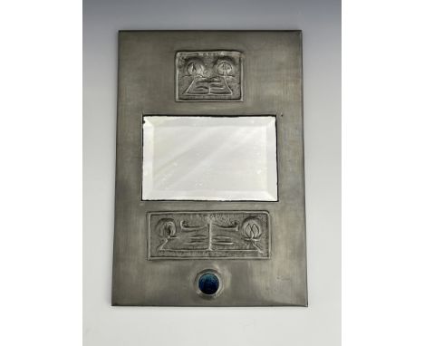 Glasgow School, an Arts and Crafts pewter and enamelled mirror, rectangular form, the bevelled glass between two repousse pan