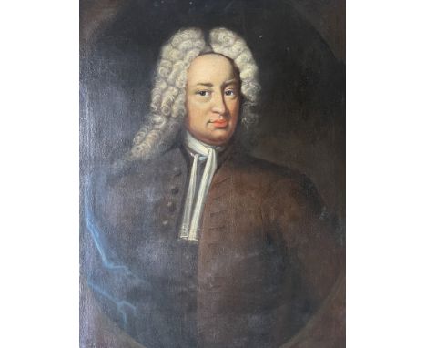 Follower of Sir Godfrey Kneller, early 18th Century, portrait of a gentleman, half length in a brown coat and blue mantle, pa
