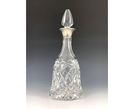 An Elizabeth II silver mounted glass decanter, 1978 Birmingham, bell shaped form with foliate and diamond cut design, stopper