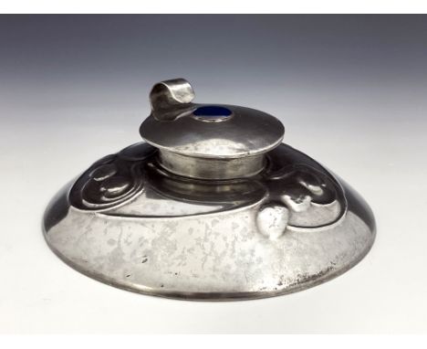 Archibald Knox for Liberty and Co., an Arts and Crafts Tudric pewter and enamelled inkwell, model 0211, wide domed form, with