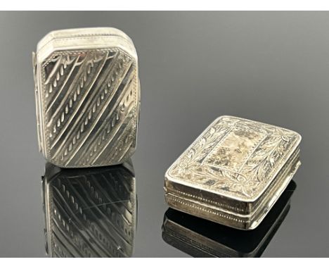 A George III silver vinaigrette, IT, Birmingham 1816, rectangular form, blank central panel bordered with garlands, gilt inte