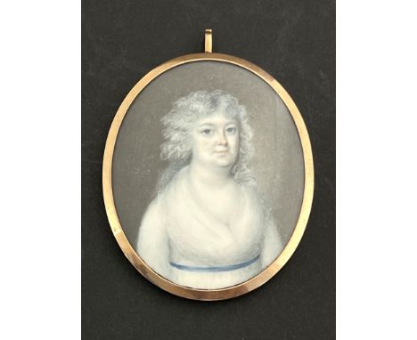 A portrait miniature on ivory, Mrs Wairman of Carhead, mother of Mrs Walker Skirrow, circa 1810, oval, with platted hair lock