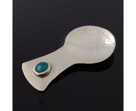 John Stuart Shellis, an Arts and Crafts style silver and enamelled caddy spoon, Birmingham 2016, the circular planished bowl 