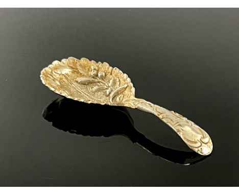 An Elizabeth II cast silver caddy spoon, F Drury Ltd., Sheffield 1980, the leaf moulded bowl with fruiting boughs, chased fol