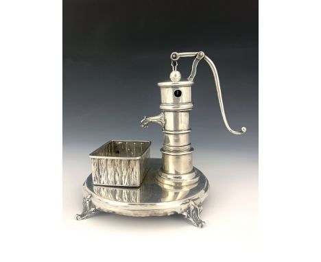 A 19th century German novelty silver cigar cutter, K&amp;S. Hamburg circa 1860, modelled as a water pump and trough, lever cu