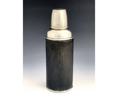 An Edwardian silver and leather flask, G &amp; Co, London 1909, cylindrical shouldered form, screw top cover, 26cm high