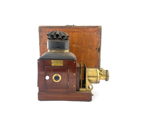 A W.C. Hughes mahogany, brass and tinplate magic lantern, late 19th Century, rack and pinion lens, sprung gate, tin chimney, 