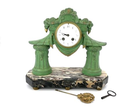 A Secessionist patinated art metal portico clock, circa 1920, the 4" white enamel dial supported on two splayed fluted column