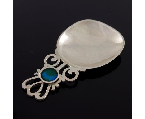 John Stuart Shellis, an Arts and Crafts style silver and enamelled caddy spoon, Birmingham 2016, the planished bowl on a pier