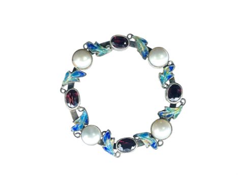 George Hunt, an Arts and Crafts silver and enamelled gem and pearl set brooch, circular wreath form, set with half pearls, cu