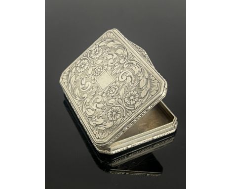A continental white metal pocket snuff box, 19th Century, of rectangular form with canted corners, bright cut engraved scroll