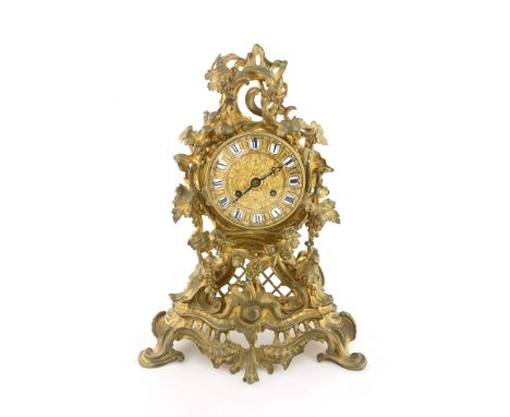 Raingo Freres, a mid 19th century French ormolu and gilt brass mantel clock, relief moulded Rococo form, the gilt embossed 4 