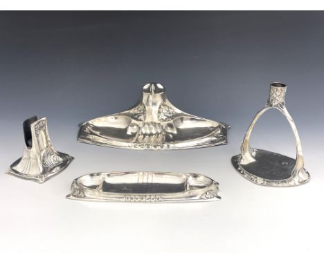 A Jugendstil silver plated four piece desk set, in the style of Orivit and WMF, circa 1905, including ink stand, pen tray, ma