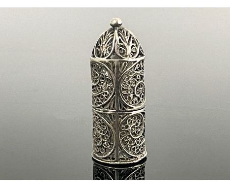 A silver filigree and glass miniature scent bottle, the facet cut and stoppered flask contained within a cylindrical and dome