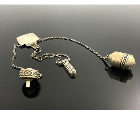 Archibald Knox for Liberty and Co., an Arts and Crafts Cymric silver chatelaine, Birmingham 1902, the stylised hammer head be