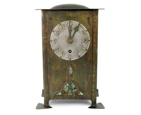 Jesson, Birkett and Co, an Arts and Crafts brass and abalone inlaid bracket clock, the silvered dial embossed with Arabic num