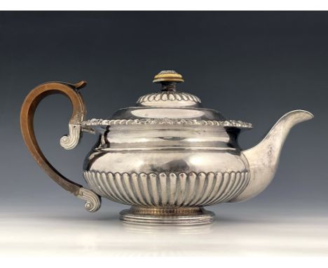 Matthew Boulton, a George III Old Sheffield Plate teapot, Birmingham circa 1810, half reeded squat ovoid form with cast shell