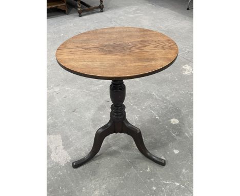 A George III country oak tripod table, circa 1820, circular tilt top, baluster turned support, cabriole base, 60cm diameter 