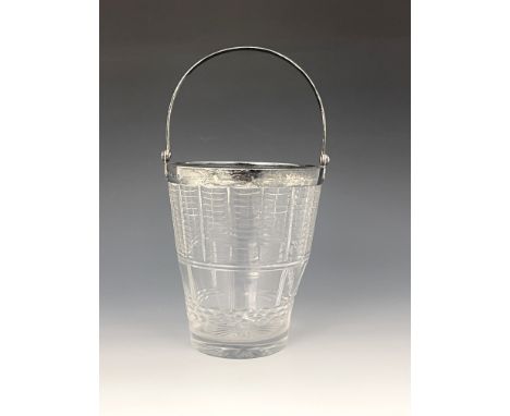 An Art Deco silver mounted cut glass ice bucket, Hukin and Heath, Birmingham 1937, pail form with swing handle, cut with geom