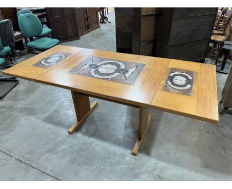 A Danish Gangso Mobler teak veneered dining table, the top with inlet ceramic tiles 71' long with two drop leaves. The lot to