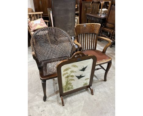 An oak office chair, a caned armchair (A.F.) and a mahogany firescreen (3)