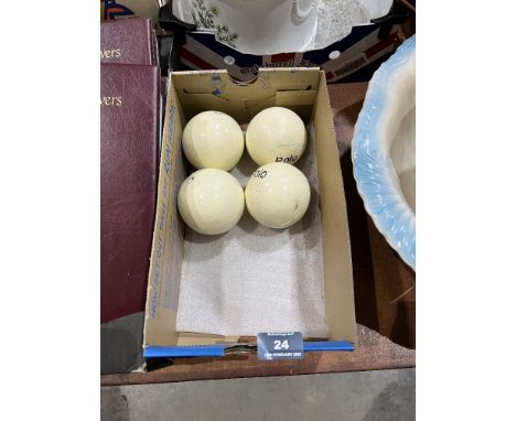 A set of four vintage polo balls