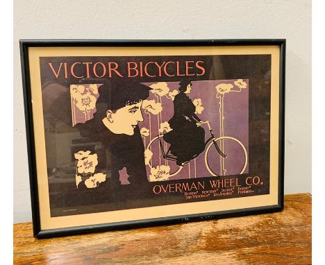 A framed Vintage Victor Bicycles poster.