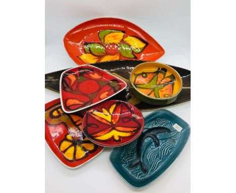 A selection of seven pieces of Poole Pottery various styles and shapes.