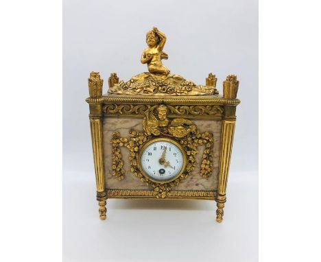 A French Gilt and marble clock with enamel face.