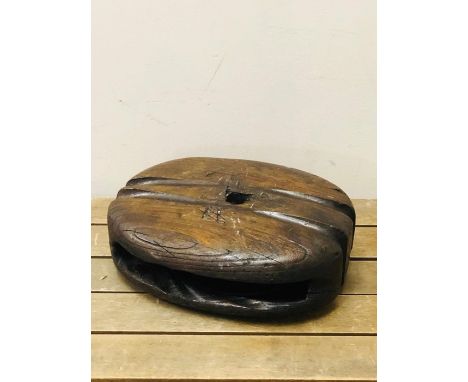 A Decorative wooden item from a ships rigging 