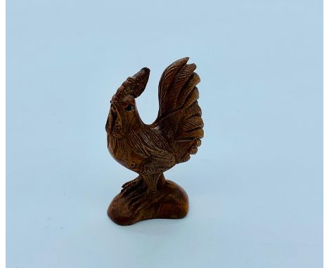 A Boxwood Japanese netsuke in the form of a rooster signed to the base