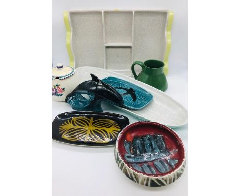Eight Poole pottery items various styles and designs.