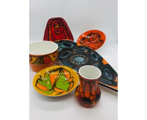 A selection of seven pieces of Poole Pottery various styles and shapes.