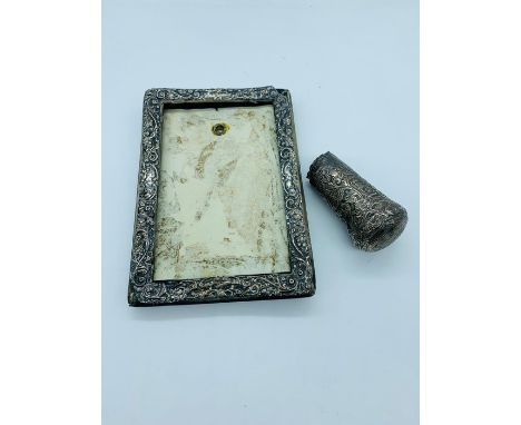 A silver picture frame and a hallmarked silver walking stick top AF