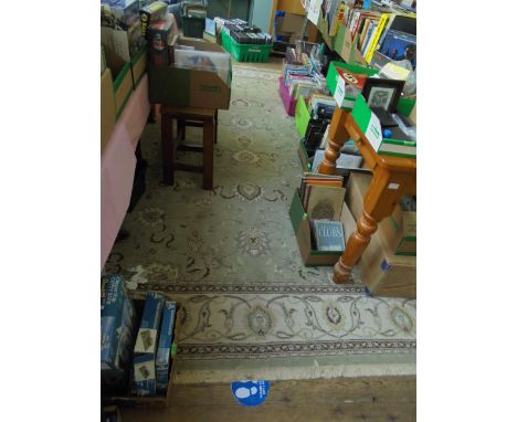 Beige, brown and light green tasselled carpet, central field inset 6 prominent multi-coloured medallions, beige medallion gar